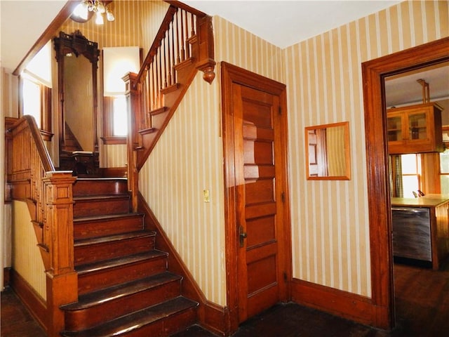 7 Walnut St, Oneonta-City, NY 13820 - stairs featuring wallpapered walls, baseboards, and wood finished floors