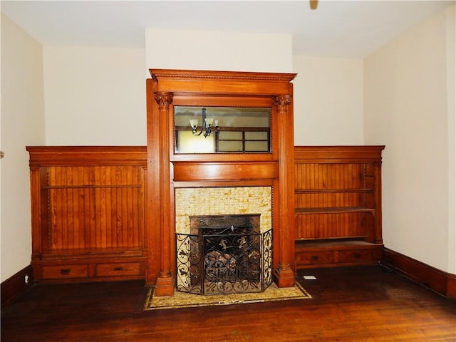 7 Walnut St, Oneonta-City, NY 13820 - living room with wood finished floors, baseboards, and a tile fireplace