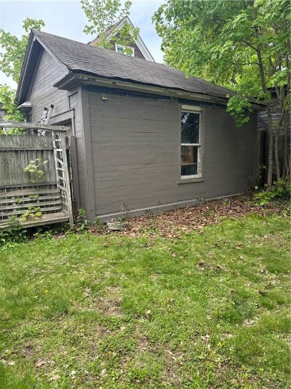 7 Walnut St, Oneonta-City, NY 13820 - view of side of property featuring a yard and roof with shingles