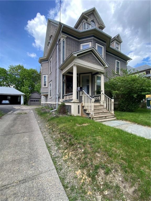 7 Walnut St, Oneonta-City, NY 13820 - view of front facade featuring a garage and covered porch