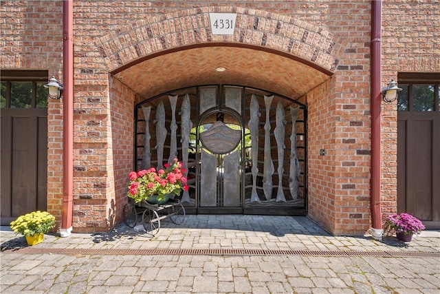 4331 Tichenor Point Dr, Canandaigua-Town, NY 14424 - view of exterior entry featuring brick siding
