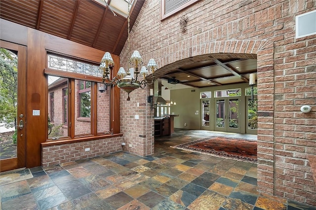 4331 Tichenor Point Dr, Canandaigua-Town, NY 14424 - interior space featuring stone tile floors, arched walkways, a towering ceiling, beamed ceiling, and ceiling fan