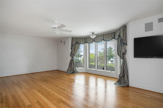 4331 Tichenor Point Dr, Canandaigua-Town, NY 14424 - spare room with baseboards, light wood-style flooring, and ceiling fan