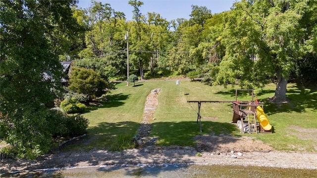 4331 Tichenor Point Dr, Canandaigua-Town, NY 14424 - view of home's community featuring a playground, a lawn, and a wooded view