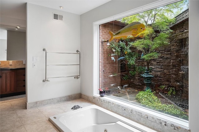 4331 Tichenor Point Dr, Canandaigua-Town, NY 14424 - full bath featuring tile patterned floors, a whirlpool tub, vanity, and baseboards