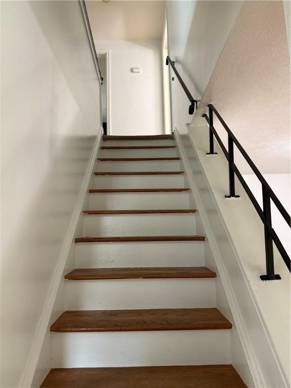167 Rogers Pkwy, Irondequoit, NY 14617 - staircase featuring wood finished floors
