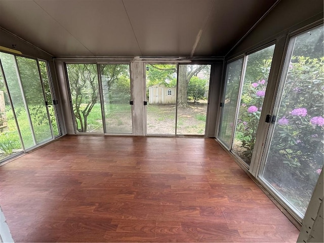 167 Rogers Pkwy, Irondequoit, NY 14617 - unfurnished sunroom with wood finished floors and a wall of windows