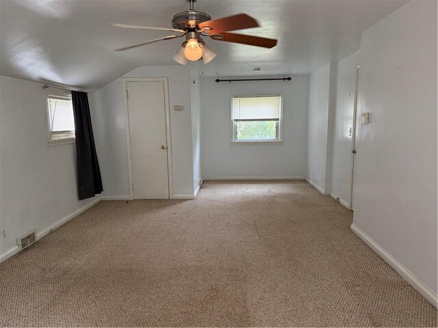 167 Rogers Pkwy, Irondequoit, NY 14617 - unfurnished room with ceiling fan, light carpet, plenty of natural light, and lofted ceiling