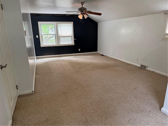 167 Rogers Pkwy, Irondequoit, NY 14617 - empty room with carpet floors, lofted ceiling, a ceiling fan, and baseboards