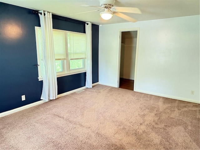 167 Rogers Pkwy, Irondequoit, NY 14617 - unfurnished bedroom featuring carpet, baseboards, a ceiling fan, and a closet