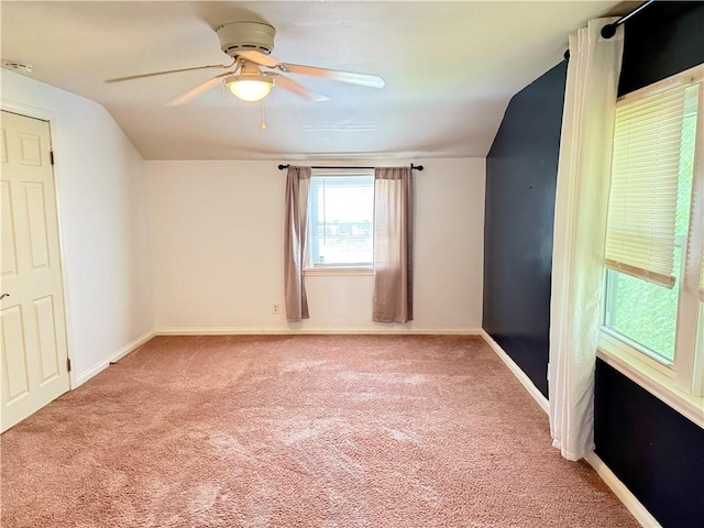 167 Rogers Pkwy, Irondequoit, NY 14617 - unfurnished bedroom featuring lofted ceiling, light carpet, baseboards, and a ceiling fan