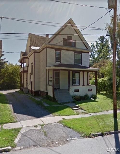 328 Winslow St, Watertown-City, NY 13601 - victorian-style house featuring covered porch and a front yard