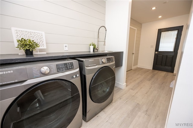 14 Wynngate Ln, Amherst, NY 14221 - laundry room with washer and clothes dryer, recessed lighting, and light wood-style flooring