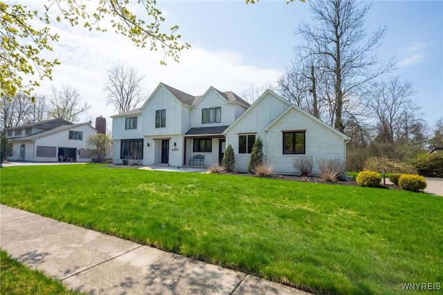 14 Wynngate Ln, Amherst, NY 14221 - modern farmhouse style home featuring a front yard and board and batten siding