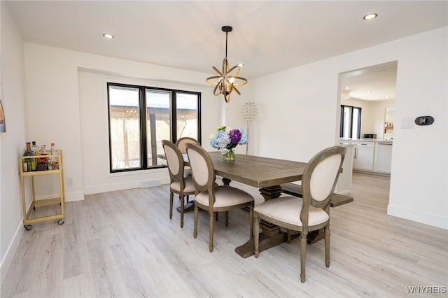 14 Wynngate Ln, Amherst, NY 14221 - dining space with light wood-style flooring, a chandelier, and recessed lighting