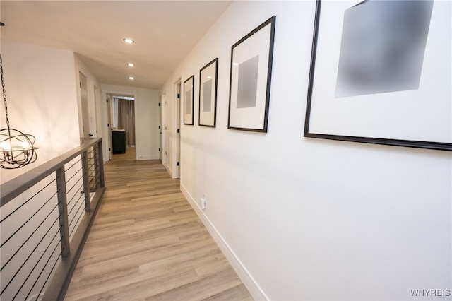 14 Wynngate Ln, Amherst, NY 14221 - hall featuring recessed lighting, light wood-type flooring, and a chandelier