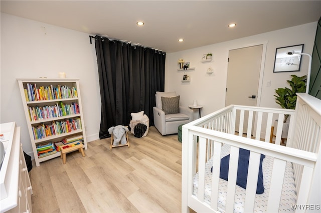14 Wynngate Ln, Amherst, NY 14221 - bedroom featuring recessed lighting, light wood-style floors, and a nursery area