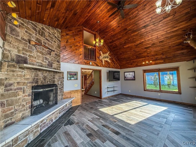 657 W Cottage Ln, Deruyter, NY 13052 - unfurnished living room featuring wooden ceiling, stairs, a chandelier, high vaulted ceiling, and a stone fireplace