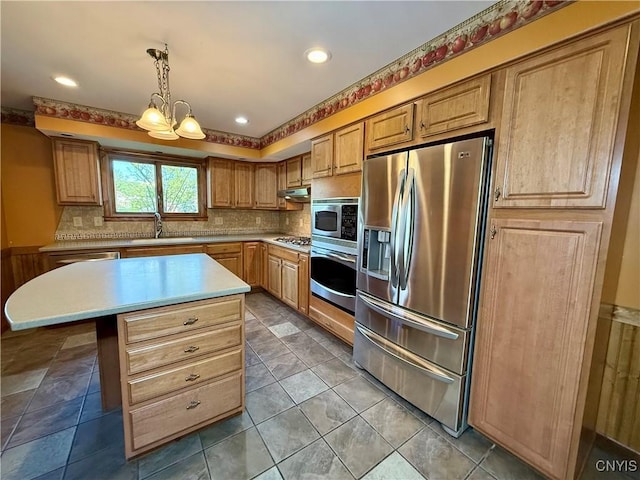 657 W Cottage Ln, Deruyter, NY 13052 - kitchen with appliances with stainless steel finishes, a sink, a chandelier, light countertops, and tasteful backsplash