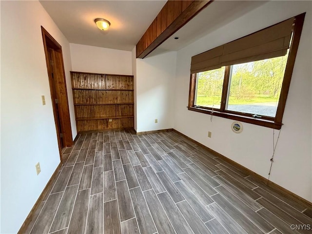 657 W Cottage Ln, Deruyter, NY 13052 - spare room featuring dark wood-style flooring and baseboards