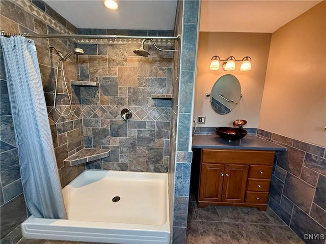 657 W Cottage Ln, Deruyter, NY 13052 - bathroom with a shower stall, vanity, tile walls, and a wainscoted wall