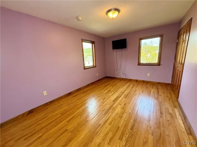 657 W Cottage Ln, Deruyter, NY 13052 - unfurnished bedroom featuring light wood-style flooring and baseboards