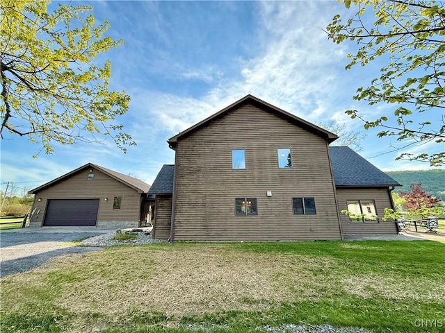 657 W Cottage Ln, Deruyter, NY 13052 - view of side of home with a lawn and a shingled roof