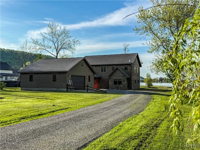 657 W Cottage Ln, Deruyter, NY 13052 - chalet / cabin with a garage, a front yard, stone siding, and driveway
