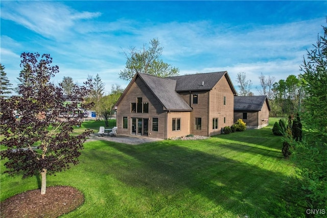 657 W Cottage Ln, Deruyter, NY 13052 - back of house with a lawn, a patio area, and a shingled roof