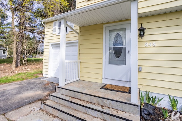 848 Weiland Rd, Greece, NY 14626 - property entrance featuring a garage