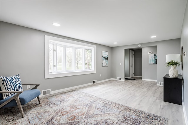848 Weiland Rd, Greece, NY 14626 - living area featuring baseboards, light wood-style floors, and recessed lighting
