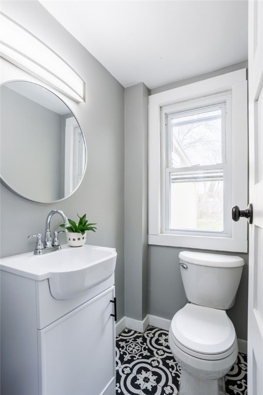 848 Weiland Rd, Greece, NY 14626 - bathroom with baseboards, toilet, and vanity