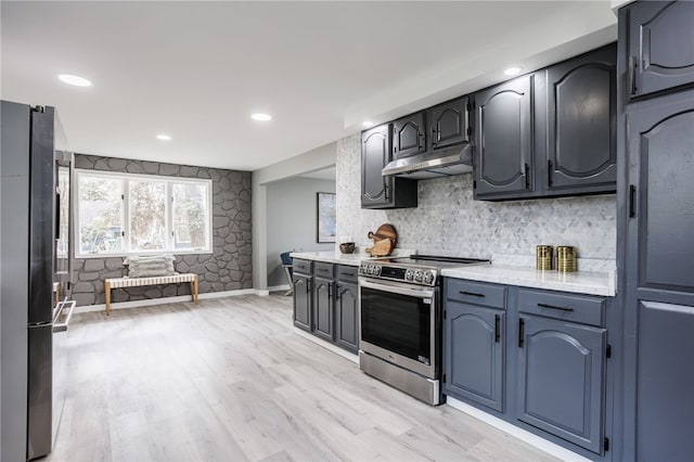 848 Weiland Rd, Greece, NY 14626 - kitchen with appliances with stainless steel finishes, under cabinet range hood, light countertops, light wood-style floors, and tasteful backsplash