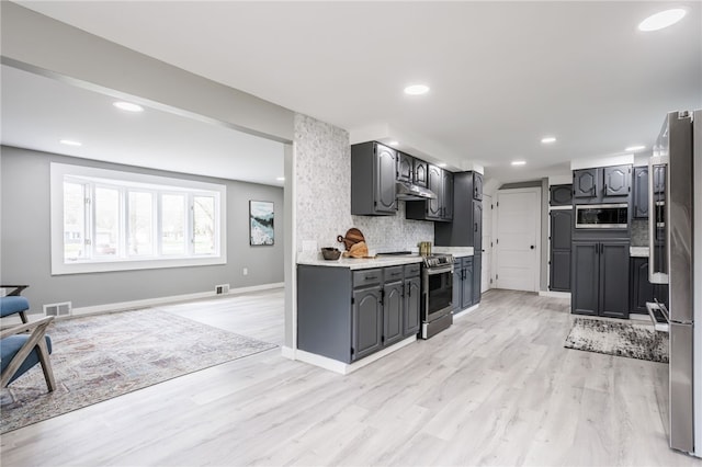 848 Weiland Rd, Greece, NY 14626 - kitchen with appliances with stainless steel finishes, under cabinet range hood, tasteful backsplash, light wood-style floors, and light countertops