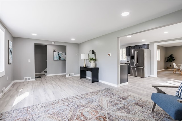 848 Weiland Rd, Greece, NY 14626 - unfurnished living room with light wood-style floors, recessed lighting, and baseboards