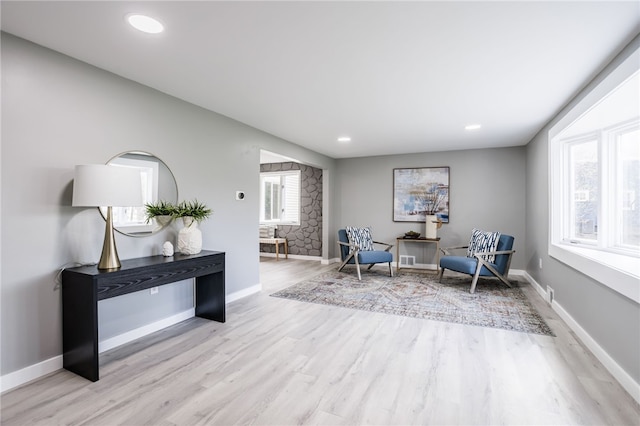 848 Weiland Rd, Greece, NY 14626 - living area with wood finished floors, baseboards, and recessed lighting