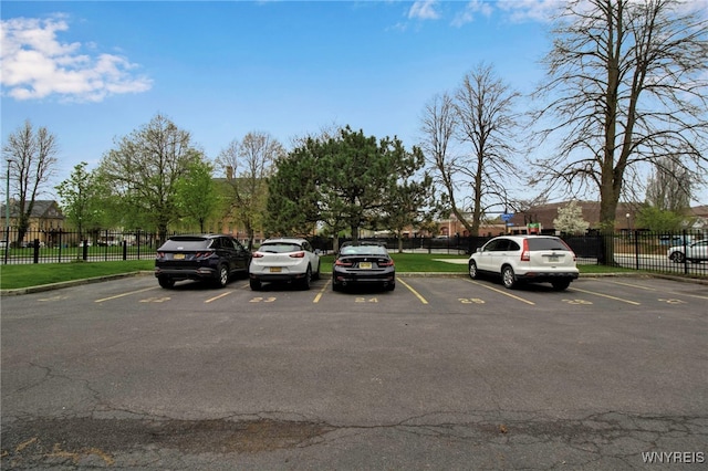125 Edward St Unit 2G, Buffalo, NY 14201 - uncovered parking lot featuring fence