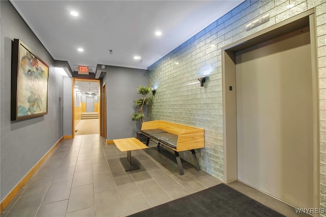 125 Edward St Unit 2G, Buffalo, NY 14201 - hallway featuring elevator, tile patterned flooring, recessed lighting, and baseboards