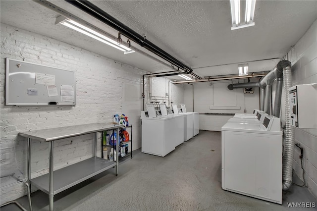 125 Edward St Unit 2G, Buffalo, NY 14201 - basement featuring washing machine and dryer and a textured ceiling