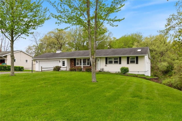 single story home with an attached garage, a front yard, and a chimney