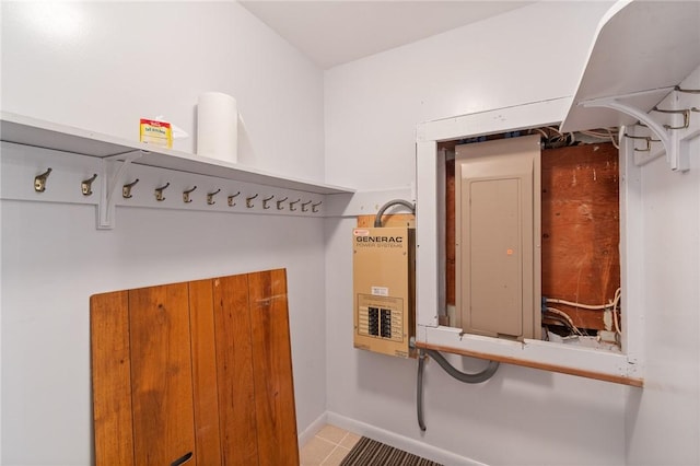 mudroom featuring electric panel, tile patterned floors, and baseboards