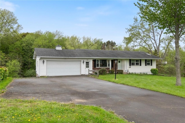 single story home featuring driveway, a garage, a front lawn, and a chimney