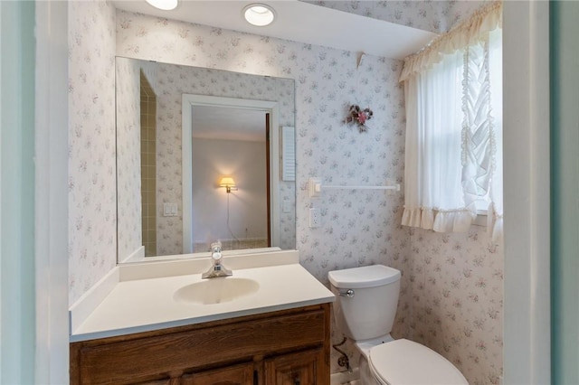 bathroom with vanity and toilet