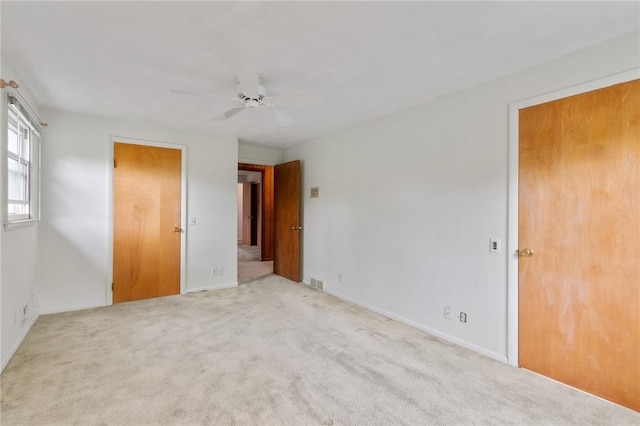 unfurnished bedroom featuring baseboards, ceiling fan, and carpet floors