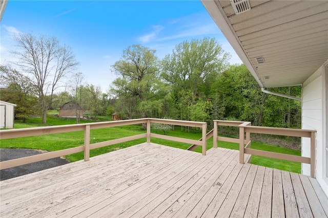 wooden deck with a yard