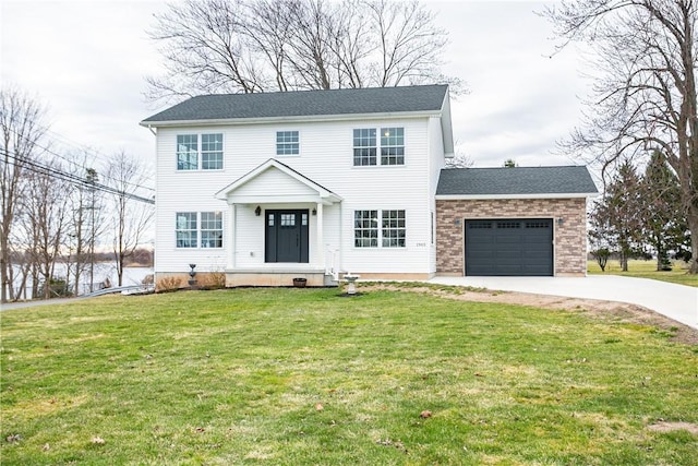 1965 Main St, Carlton, NY 14571 - colonial inspired home with concrete driveway, a garage, and a front lawn