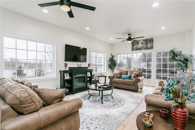 1965 Main St, Carlton, NY 14571 - living room featuring a ceiling fan, recessed lighting, wood finished floors, and a glass covered fireplace