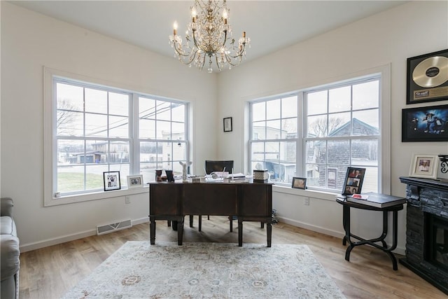 1965 Main St, Carlton, NY 14571 - office area featuring plenty of natural light, a chandelier, and light wood-style flooring
