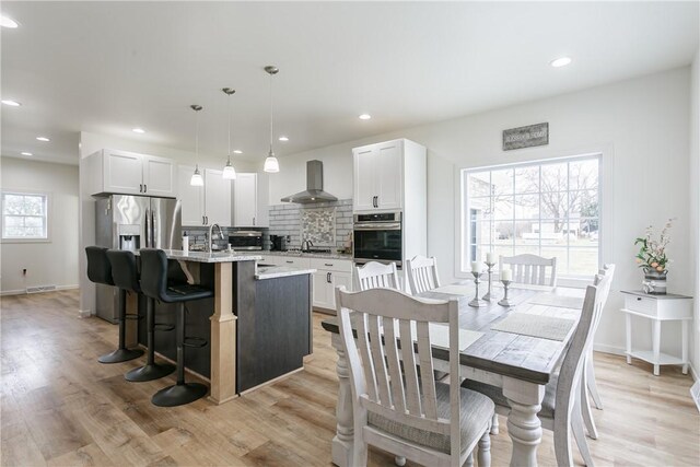 1965 Main St, Carlton, NY 14571 - dining room with light wood-type flooring, recessed lighting, and baseboards