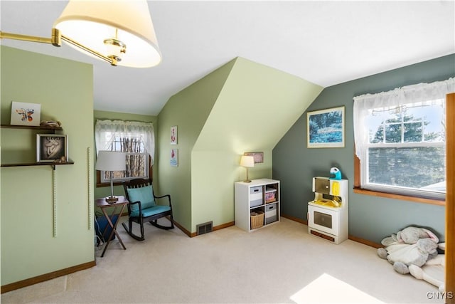 recreation room with lofted ceiling, carpet floors, and baseboards